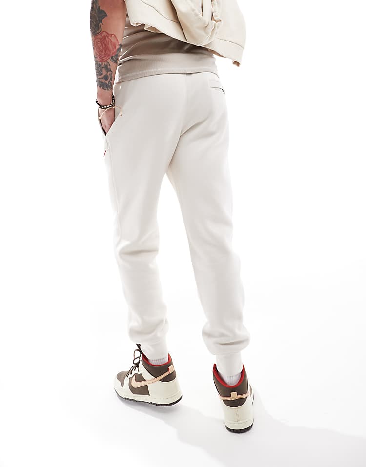 Nike Club Chenile Futura logo joggers in beige