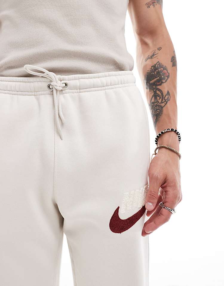 Nike Club Chenile Futura logo joggers in beige